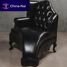 Classic armchair THE MELTINGleatherwith footrestwing
