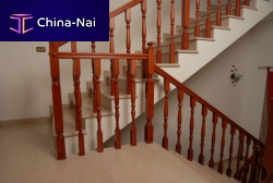 Wooden railing with barsindoorfor stair