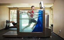 Underwater treadmill with handrails