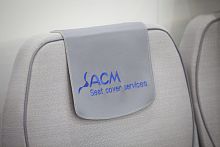 Aircraft cabin headrest cover