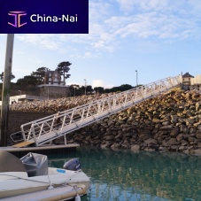 Dock gangway with handrails
